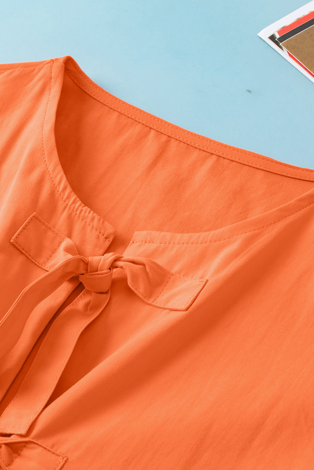 Grapefruit Orange Knotted Puff Short Sleeve Peplum Blouse